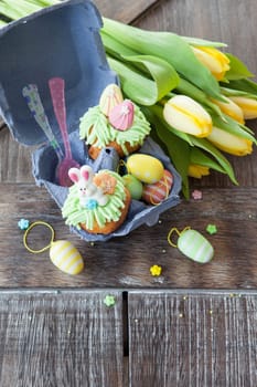Small colorfully decorated cupcake for Easter