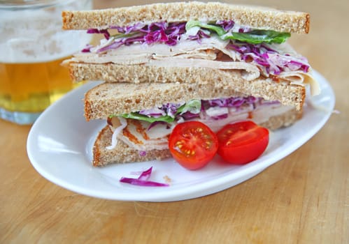 Turkey sandwich on whole wheat bread cut in half