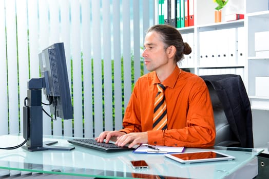 young business man at his desk working