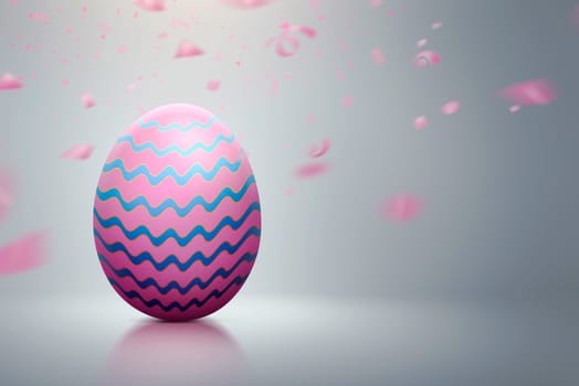 Colorful easter egg with pink confetti on gray background