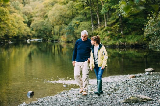 Senior couple are nejoying a walk around the Lake District together.