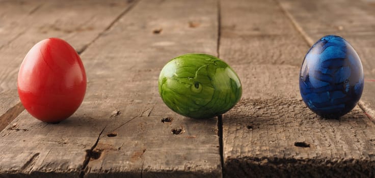 Easter egg on a rustic wooden table, Happy Easter background