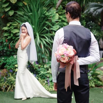 Man holding bouquet flower behind his back to surprise woman, love and valentine concept