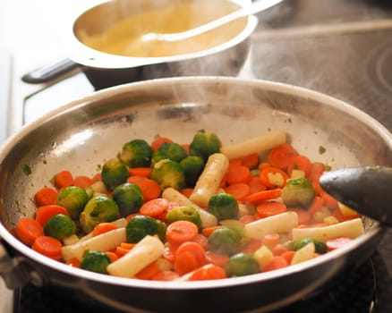 Tasty fried vegetables in a pan, healthy food or vegetarian food concept