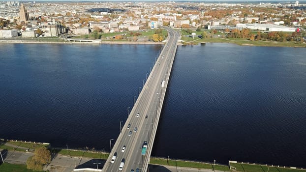 Cars on river Daugava bridge Riga Latvia aerial drone top view