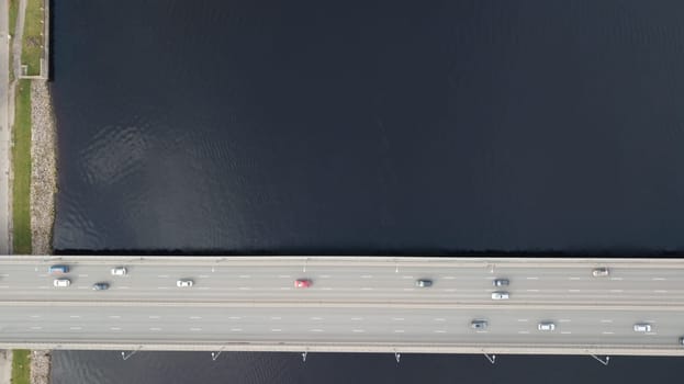 Cars on river Daugava bridge Riga Latvia aerial drone top view