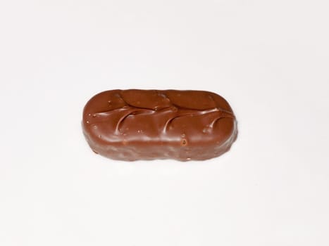 brown chocolate bounty bar on white surface sweets food  essex  england  uk