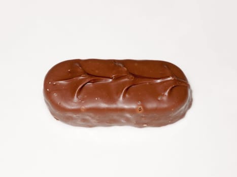 brown chocolate bounty bar on white surface sweets food  essex  england  uk
