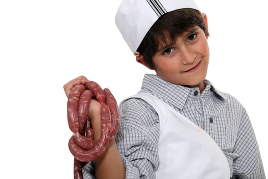 Small boy pretending to be butcher