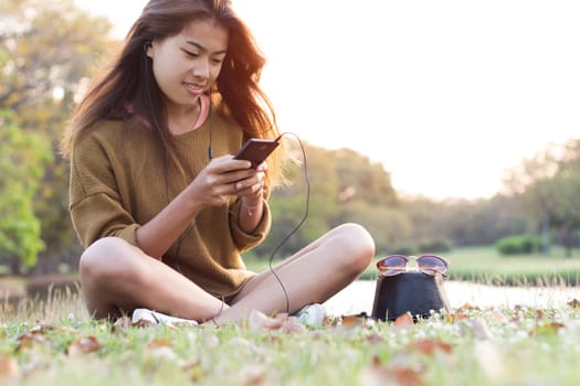 women feel relax use smart phone mobile at evening