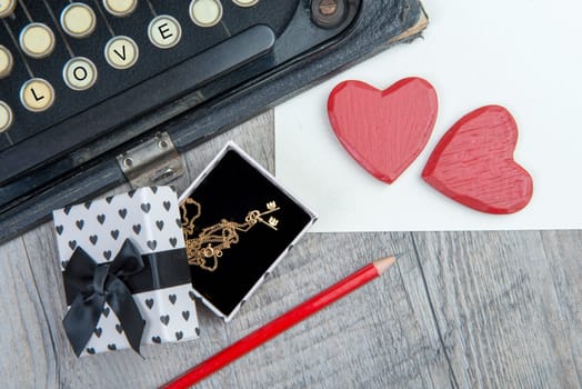 Gift, hearts and typewriter for Valentine's day