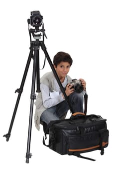 Boy with equipment of photographer
