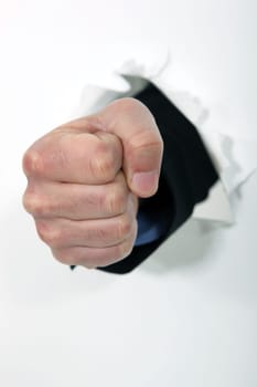 A fist punching through a wall