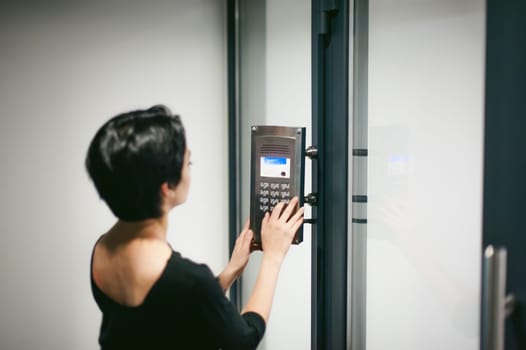 woman is calling on the intercom