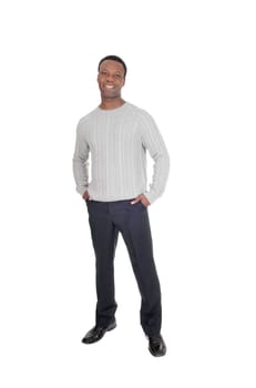 A tall good looking African American man standing in dress pants and.a gray sweater from the front, isolated for white background.