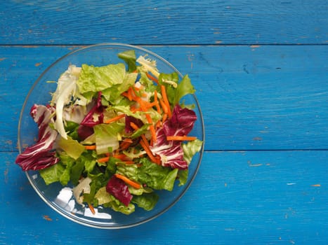 Fresh lettuce on a wooden table, healthy food or diet concept background