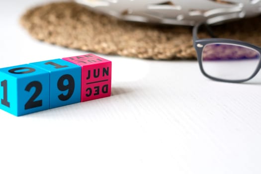 modern perpetual calendar composed of colored cubes and set at the date of June 29