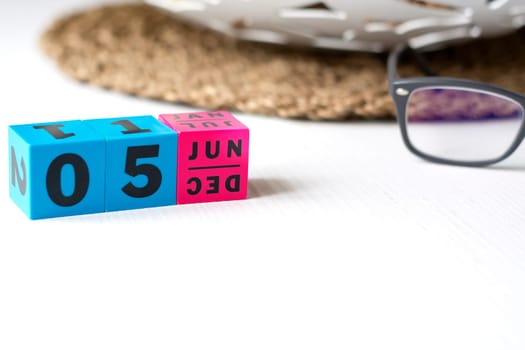 modern perpetual calendar composed of colored cubes and set at the date of June 5