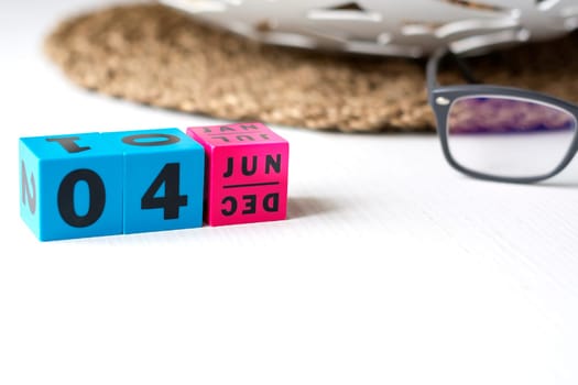 modern perpetual calendar composed of colored cubes and set at the date of June 4