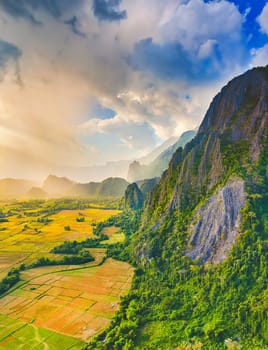 Aerial view of the fields and mountain. Beautiful landscape. Vang Vieng. Laos.