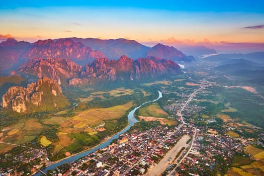 Aerial view of the fields, river and mountain. Beautiful landscape. Vang Vieng. Laos.