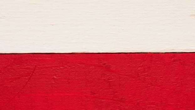 Polish flag on rustic wood using as background with space for text or image