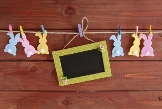 Colorful Easter decoration on a rustic wooden background
