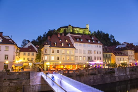 Evening panorama of Ljubljana riverfront, architecture and castle, capital of Slovenia.