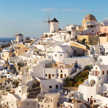 World famous Oia village or Ia at sunset, Santorini island, Greece.