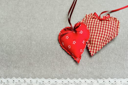 Hearts made of fabric as a romantic background