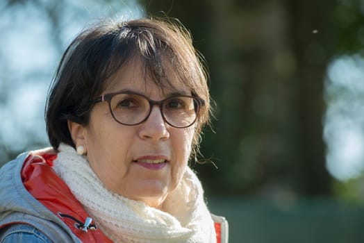 portrait of a middle-aged woman in the spring sun