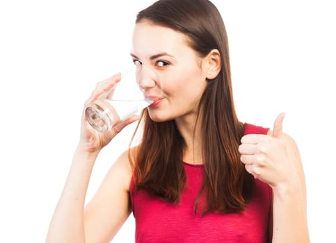 Portrait of a smiling woman drinking a glass of water, health concept, isolated on white