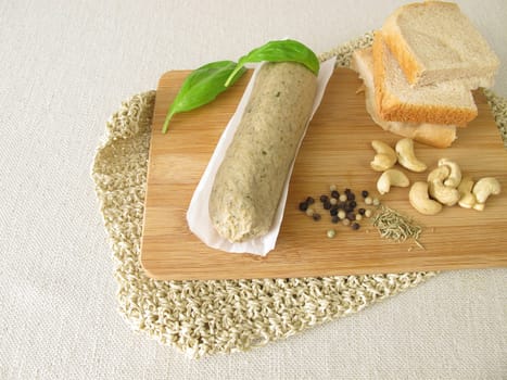 Homemade vegan liver sausage from ceshewn nuts with pepper and rosemary
