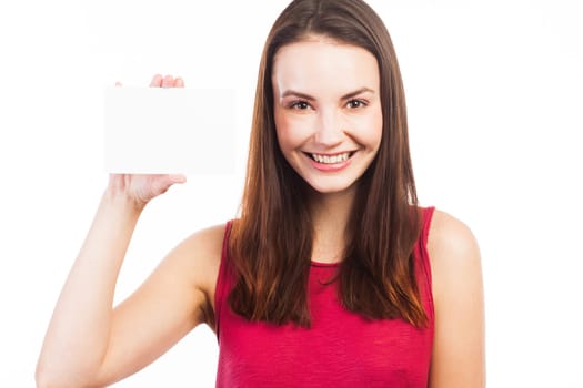 Young brunette showing a blank business card, isolated on white