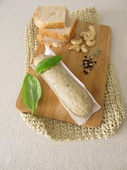 Homemade vegan liver sausage from ceshewn nuts with pepper and rosemary