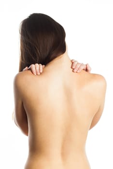 Young woman feeling pain on her back, isolated on white