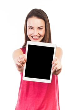 Attractive young woman showing the blank screen of an electronic tablet, isolated on white