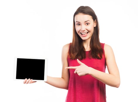 Cute woman holding and showing the blank screen of an electronic tablet, isolated on white