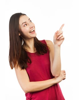 Happy woman pointing at copy space, isolated on white