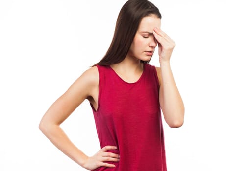 Portrait of a beautiful woman having a headache or looking stressed, isolated on white