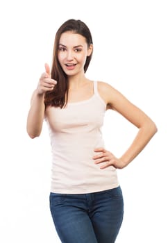 Cheerful woman pointing at the photographer, isolated on white