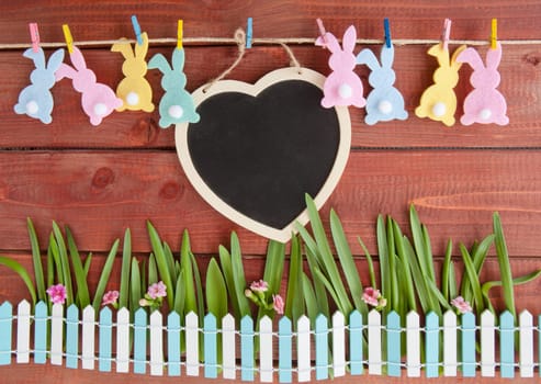 Colorful Easter decoration on a rustic wooden background