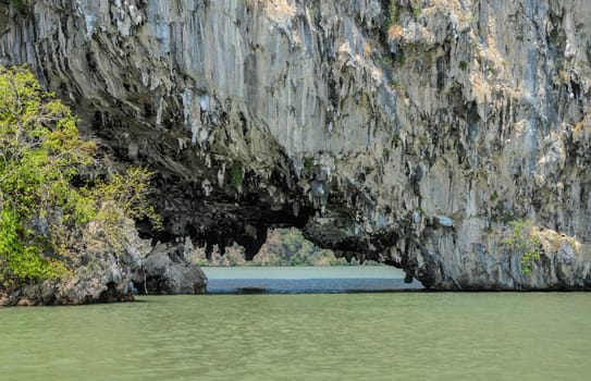 Sea cave of limestone island in Phang Nga Bay National Park, Thailand. The popular tourist destination for canoeing or kayaking