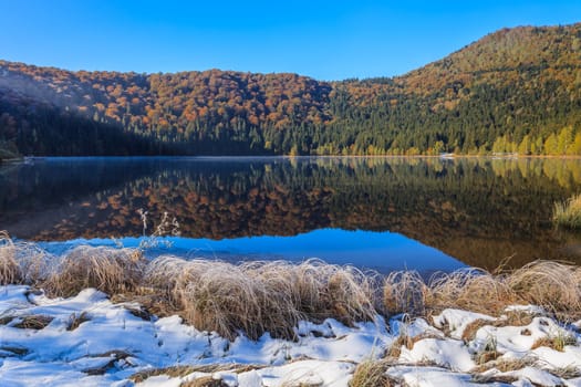 Autumn landscape at Saint Anna Lake which is located in a volcanic crate from Romania