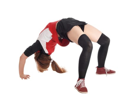 A young slim woman making a bridge on the floor in the studio .in an exercise outfit, isolated for white background.