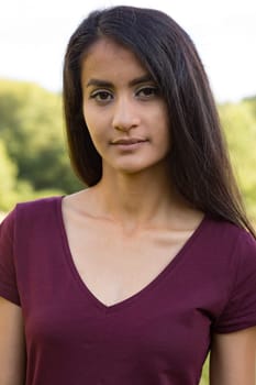 Portrait of a young woman with long black hair