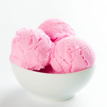 Strawberry ice cream in bowl on white background.
