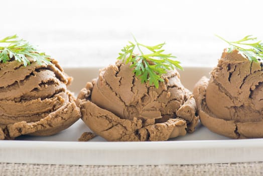 Close up plate of chocolate ice cream on dining table.