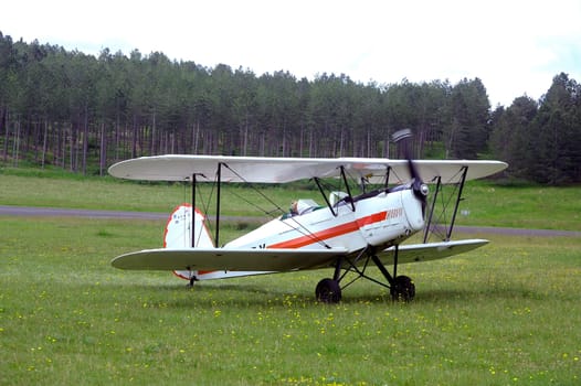 landing a biplane rolling on the Mende airfield in the French department of Gard to go to park in the place reserved for him
