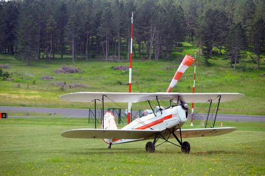 landing a biplane rolling on the Mende airfield in the French department of Gard to go to park in the place reserved for him